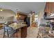 Open concept kitchen with granite counters, a breakfast bar, and seamless access to the dining area at 106 Contender Dr, Clayton, NC 27520