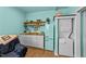 Cozy kitchenette with fridge, microwave, and stacked washer/dryer at 106 Contender Dr, Clayton, NC 27520