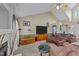 Cozy living room with a ceiling fan and fireplace, perfect for relaxing and entertaining at 106 Contender Dr, Clayton, NC 27520