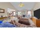 Open-concept living area featuring plush seating and easy access to the kitchen at 106 Contender Dr, Clayton, NC 27520