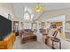 Bright living room with high ceilings, comfortable seating, and a kitchen view at 106 Contender Dr, Clayton, NC 27520