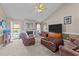 Comfortable living room with fireplace, plush seating, and access to the pool area at 106 Contender Dr, Clayton, NC 27520