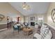 Spacious living room with fireplace, carpet, lots of seating and a view to the breakfast bar at 106 Contender Dr, Clayton, NC 27520