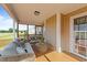 Inviting screened-in porch with comfortable seating and a view of the serene yard at 106 Contender Dr, Clayton, NC 27520