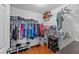Spacious walk-in closet with custom shelving and ample hanging space, ideal for wardrobe organization at 106 Contender Dr, Clayton, NC 27520