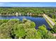Breathtaking aerial view of a lake surrounded by lush greenery and waterfront homes at 106 Silverwood Ln, Cary, NC 27518