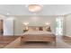 Comfortable bedroom with a wooden bed frame, soft lighting, and neutral decor for a relaxing ambiance at 106 Silverwood Ln, Cary, NC 27518