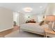 Spacious bedroom boasts hardwood flooring, a large window, neutral paint, and a cozy seating area at 106 Silverwood Ln, Cary, NC 27518