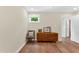 Spacious bedroom boasting hardwood flooring, a large window, neutral paint, and a wooden dresser at 106 Silverwood Ln, Cary, NC 27518