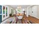 Charming dining room adjacent to the kitchen, featuring large windows and a view of the outdoor deck at 106 Silverwood Ln, Cary, NC 27518