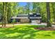 Attractive home with a two-car garage, beautiful lawn, and meticulous landscaping at 106 Silverwood Ln, Cary, NC 27518