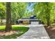 Charming home surrounded by mature trees and well-maintained landscaping at 106 Silverwood Ln, Cary, NC 27518