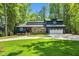 Beautifully landscaped home with a two-car garage and lush green lawn at 106 Silverwood Ln, Cary, NC 27518