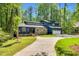 Desirable home showcasing curb appeal with an extended driveway and pristine lawn at 106 Silverwood Ln, Cary, NC 27518