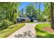 Two-story home with mature trees, inviting curb appeal, and a spacious driveway at 106 Silverwood Ln, Cary, NC 27518