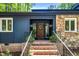 Inviting entrance with brick steps, an accent door, and stylish exterior details at 106 Silverwood Ln, Cary, NC 27518