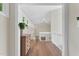 Upstairs hallway with light wood floors, a tall vaulted ceiling and windows to allow for lots of natural light at 106 Silverwood Ln, Cary, NC 27518