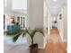 Hallway leads to a bright living space with hardwood floors and neutral walls at 106 Silverwood Ln, Cary, NC 27518