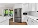 Modern kitchen features stainless steel refrigerator and access to deck at 106 Silverwood Ln, Cary, NC 27518