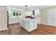 Bright, modern kitchen featuring a center island, stainless steel appliances, and ample counter space at 106 Silverwood Ln, Cary, NC 27518