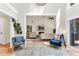 Stylish living room featuring tall ceilings, a cozy fireplace, and comfortable seating, creating an inviting space at 106 Silverwood Ln, Cary, NC 27518