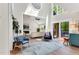 Spacious living room features high ceilings, large windows, and a cozy seating area at 106 Silverwood Ln, Cary, NC 27518