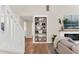 Bright living room features hardwood floors, built-in shelves, fireplace and comfortable seating at 106 Silverwood Ln, Cary, NC 27518