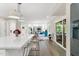 Open-concept living space with hardwood floors, seating, and a view of the dining room at 106 Silverwood Ln, Cary, NC 27518