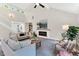 Spacious living room featuring vaulted ceilings, a fireplace, and an open staircase, perfect for entertaining at 106 Silverwood Ln, Cary, NC 27518