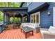 Outdoor seating area includes wicker furniture for lounging on the beautiful wood deck at 106 Silverwood Ln, Cary, NC 27518