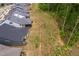 Aerial view of neighborhood backyards next to a hillside with forest at 109 Imagine Way, Pittsboro, NC 27312