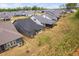 Aerial view of the properties showing the backyards and patio areas of several homes in the neighborhood at 109 Imagine Way, Pittsboro, NC 27312