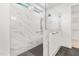 Bathroom featuring tiled shower with glass partition and fixtures at 109 Imagine Way, Pittsboro, NC 27312