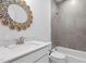 Bathroom featuring quartz vanity, decorative mirror, and shower at 109 Imagine Way, Pittsboro, NC 27312