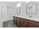 Bathroom with double sink vanity, quartz countertops, and tile flooring at 109 Imagine Way, Pittsboro, NC 27312
