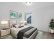 Bedroom featuring neutral carpet, a bed, artwork, lighting, and a window at 109 Imagine Way, Pittsboro, NC 27312