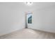 Cozy bedroom with neutral carpet, light walls, baseboard molding, and a window at 109 Imagine Way, Pittsboro, NC 27312