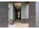 Inviting covered entryway with brick columns welcomes guests to this beautifully designed home at 109 Imagine Way, Pittsboro, NC 27312