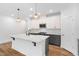 Kitchen with large island, stainless appliances and modern finishes at 109 Imagine Way, Pittsboro, NC 27312