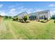 Spacious backyard with a patio and well-manicured lawn at 1121 Coast Grade St, Wake Forest, NC 27587