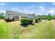 Beautifully landscaped backyard with lush green lawn and well maintained shrubs and greenery at 1121 Coast Grade St, Wake Forest, NC 27587