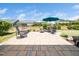 Backyard patio features an outdoor dining set and comfortable seating for entertaining and enjoying outdoor living at 1121 Coast Grade St, Wake Forest, NC 27587