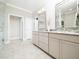 Modern bathroom features double vanity with granite countertop and tiled floors at 1121 Coast Grade St, Wake Forest, NC 27587
