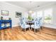 The dining room features a modern chandelier and a table set for a dinner party at 1121 Coast Grade St, Wake Forest, NC 27587