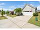 A view of the lovely home's driveway and garage with an American flag displayed at 1121 Coast Grade St, Wake Forest, NC 27587