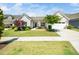 Charming single story home with a well manicured lawn and beautiful landscaping at 1121 Coast Grade St, Wake Forest, NC 27587