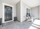 Inviting front porch with stylish tile flooring and comfortable seating at 1121 Coast Grade St, Wake Forest, NC 27587
