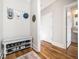 Inviting hallway with bench seating, coat hooks, and hardwood flooring at 1121 Coast Grade St, Wake Forest, NC 27587