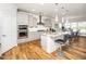 Modern kitchen features stainless appliances, granite countertops, and island seating at 1121 Coast Grade St, Wake Forest, NC 27587