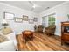 Cozy living room featuring hardwood floors, neutral tones, and a ceiling fan at 1121 Coast Grade St, Wake Forest, NC 27587